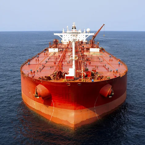 An orange tanker seen from the bow